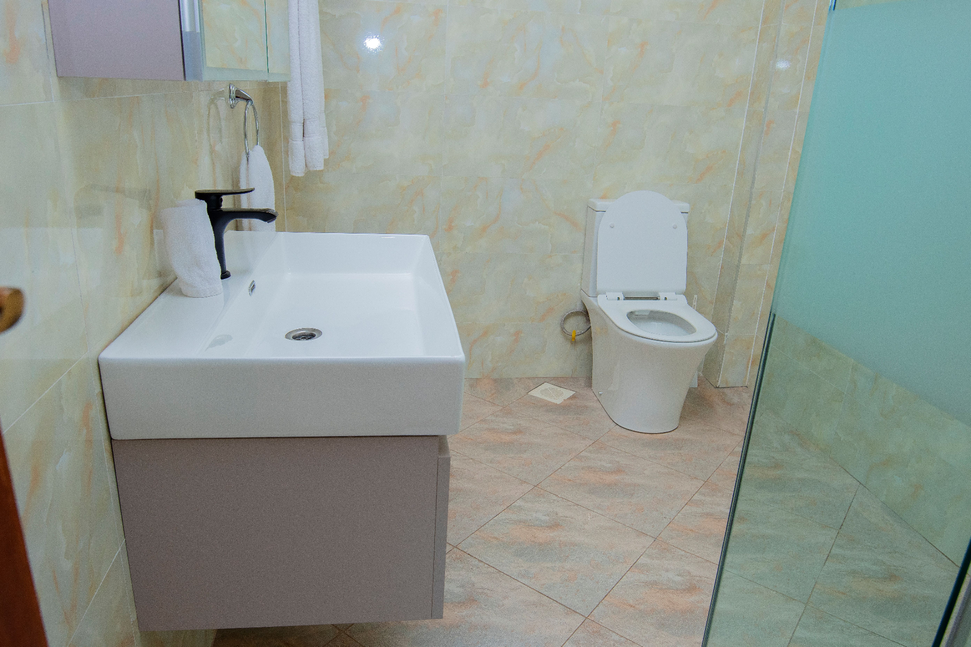 Two-Bedroom Furnished – ensuite bathroom with vanity and toilet